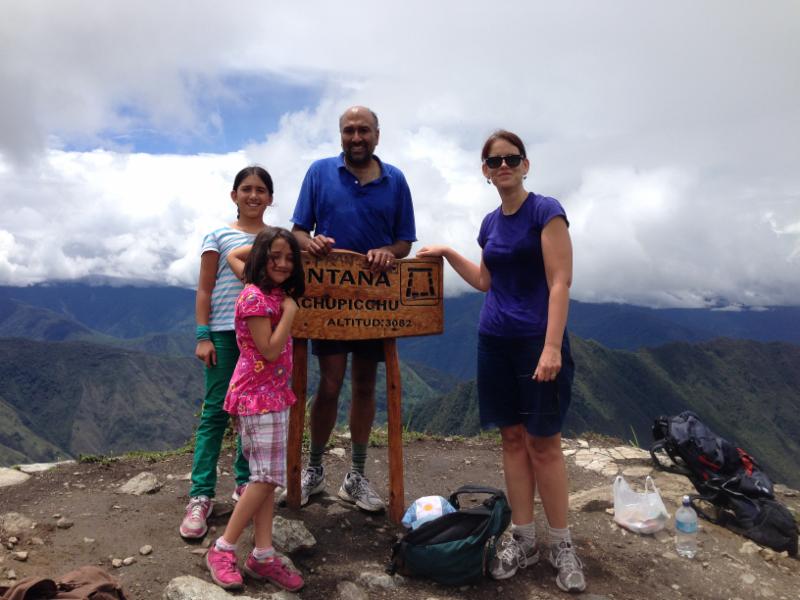 Professor Kathie Barnes, her husband (UA Economics Professor Gautam Gowrisankaran), and two of their three daughters at the top of Machu Picchu. 
