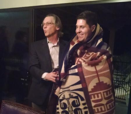 Professor Rob Williams honors Gabe Galanda with a blanket presentation.