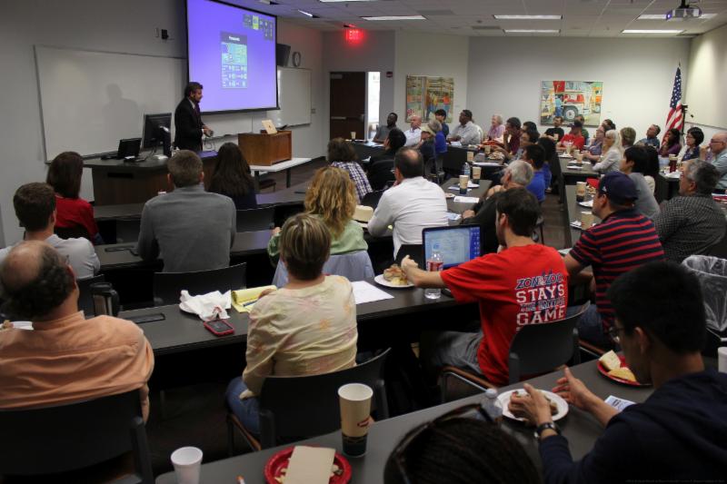 Alex Lane delivering a Law.Change talk to a full house.
